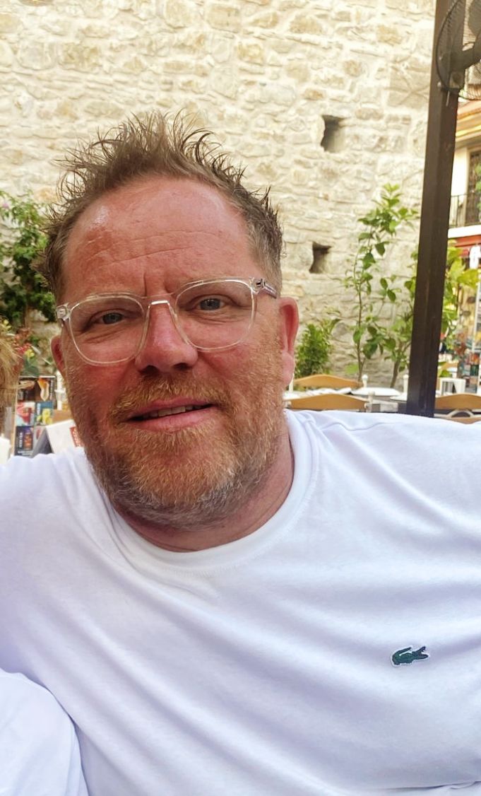 Male in glasses and white t-shirt